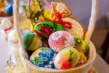 Traditional Easter basket with colorful handmade Easter origami eggs and gingerbread Easter lamb.