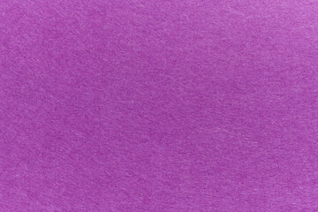 Soft felt textile material purple colors, colorful texture flap fabric background closeup