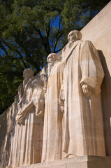 statues of Geneva reformation founders at Reformation wall in Geneva