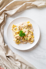 tortellini pasta with mushroom cream sauce and cheese