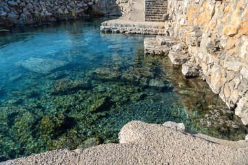 Pool of Kapukargin natural sulfur thermal bath near Dalaman town in Mugla, Turkey.