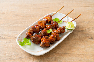 grilled chicken gizzard skewer with herbs and spices
