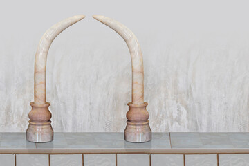 front view marble couple tusks on marble candlesticks on marble floor, old cement wall background, object, decor, vintage, copy space