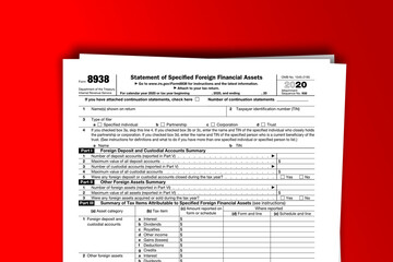 Form 8938 documentation published IRS USA 10.30.2020. American tax document on colored