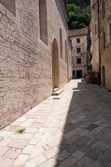 Narrow street of the old historical town of Kotor, southern Europe. Travel concept