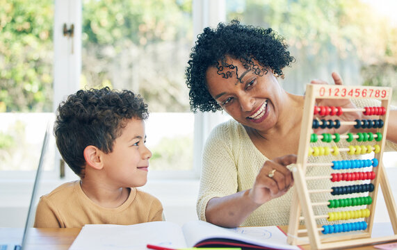 Education, grandmother or child learning math for kindergarten school homework or abacus at home. Smile, counting or happy senior woman working or helping a smart young boy student with development