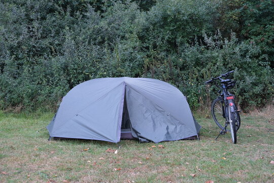Pitched tent and a bicycle