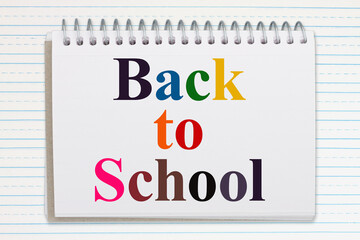 Back to school message on a notepad on lined paper