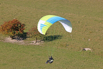 Paraglider flying from a hill	
