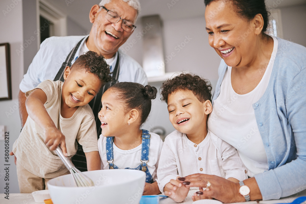 Wall mural Are those little balls or lumps. Shot of a mature couple baking with their grandkids at home.