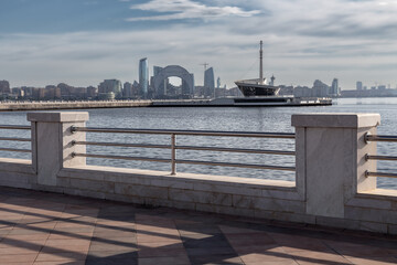 View from embankment to modern city skyline with skyscrapers on seafront, Baku, Azerbaijan