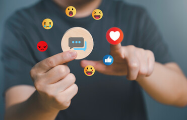 Hand of customer picking Love button on Social media. The concept of Social media and digital online. Watch Live streaming and message, likes, emoji feedback, satisfaction, review, evaluation concept.