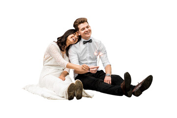 Happy wedding young couple sitting on the floor with sparklers on isolated png background - 580066675