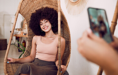 Black woman, smile and swing chair with a phone for a photograph for social media, blog or online...