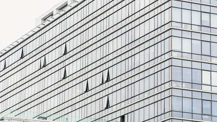 Skyscraper glass facade. Office exterior. Details of complex high rise building. Financial district. Glass facade building Tech industry