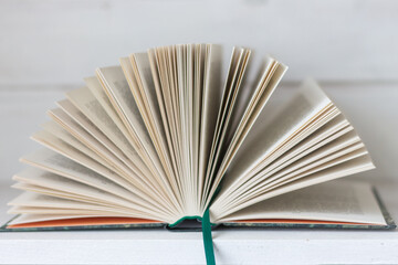 Open book isolated on white background. Open book with pages. Education concept. Reading books. Literature background. Wisdom and knowledge. Book with bookmark.
