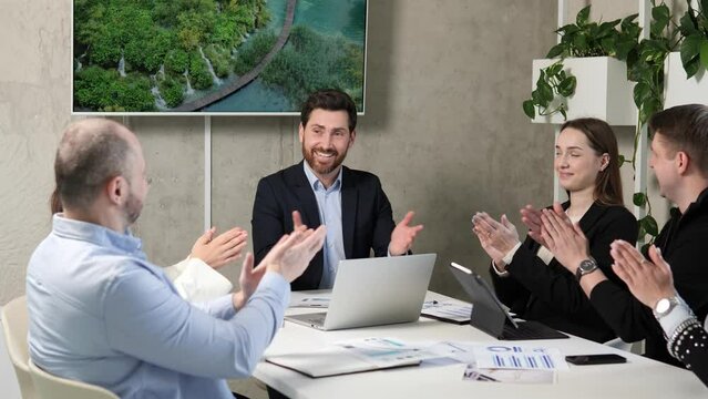 People applaud at the meeting, business conference of modern eco technologies. Achieving highest results. Company profit growth through innovation. Exciting experts share their knowledge and insights.