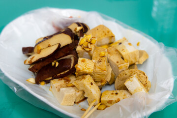 Dish with slice of tofu