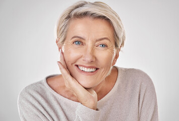 Face of beauty, mature woman with care and wellness in studio. Smile with natural makeup, anti...