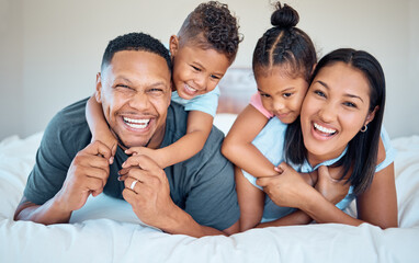 Obraz premium Happy, love and family with a smile on a bed to relax together in bedroom of their house. Happiness, father and mother laying in the room with children while bonding, relaxing and having fun at home.