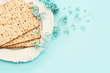 Pesah celebration concept (jewish Passover holiday) over pastel blue background