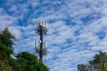 Cellular phone antenna in a national park with sky background. Antennas for receiving and...