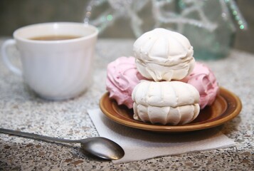 Close up cup of coffee and sweet marshmallow dessert