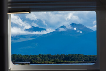 Norwegian landscape framed in the window of a ferry