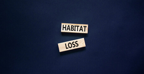 Habitat loss symbol. Concept words Habitat loss on wooden block. Beautiful black table black background. Business habitat loss concept. Copy space.