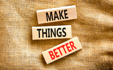 Make things better symbol. Concept words Make things better on wooden block on a beautiful canvas table canvas background. Business and make things better concept. Copy space.