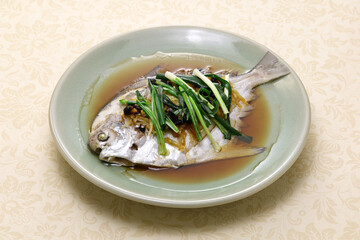 Chinese steamed whole pomfret fish