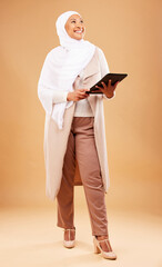 Fototapeta premium Fashion, muslim and woman with tablet in studio isolated on a brown background mock up. Technology, touchscreen and mature Islamic female thinking of internet browsing, social media or web scrolling.