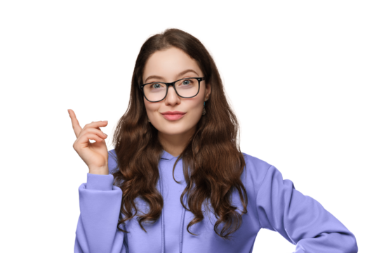 A smiling teenage girl with long hair and glasses. The girl is wearing a violet oversized sweatshirt, pointing up. - Powered by Adobe