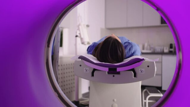 A female patient in a tomographic scanner. Tomograph, Patient on magnetic resonance imaging