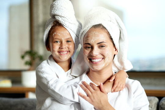 Facial, Beauty And Skincare At A Spa For A Bonding Mother And Daughter. Portrait Of A Cheerful, Loving And Joyful Little Girl Enjoying A Relaxing Pamper Session Together With Her Mom Or Single Parent