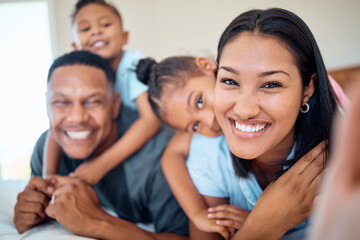 Fototapeta premium Family selfie, children and bonding in bedroom of house, home or hotel in trust, love or security pov. Portrait, smile or happy mother, father and kids in photography for social media profile picture