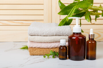 Home spa. Everyday hygiene. Natural bodycare products on background of bathroom wooden louvered...