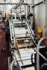 Huge factory line for sweet food and cookies production. Conveyor belt waffle production line.