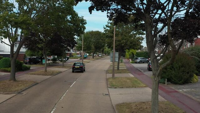 POV flying backwards over road with car