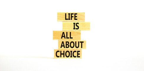 Choice and life symbol. Concept words Life is all about choice on wooden blocks. Beautiful white table white background. Business choice and life concept. Copy space.