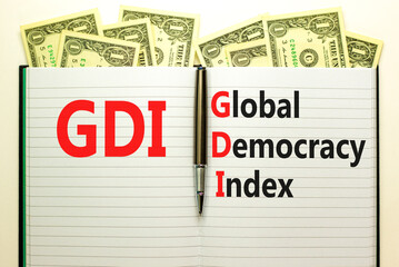 GDI global democracy index symbol. Concept words GDI global democracy index on white note on...