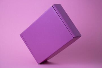 Lilac gift closed box on pink background