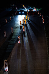 Fototapeta na wymiar Cars on a road with roadworks. Works on the road. Night traffic.