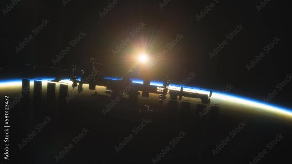 Wall mural international space station iss floating in orbit above planet earth in outer space. sunrise or suns