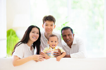 Obraz na płótnie Canvas Beautiful family with kids at home