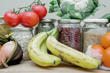 Composition of food in reusable packaging, mesh bags and glass jars. The concept of life and shopping without waste. No plastic.