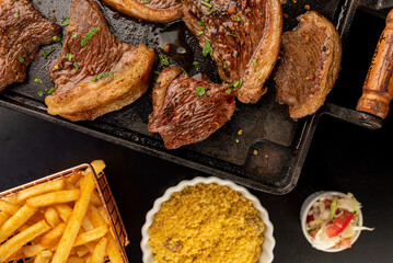 Food - Picanha on the plate with farofa, vinaigrette and fries