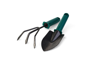 Garden hand tools. Green garden ripper and shovel on a white background.