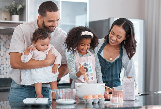 Mother, Father And Children In Kitchen Baking With Smile On Face And Help Cooking Together. Family, Fun Learning And Teaching Girl To Bake, Man And Woman With Happy Kids Family Home In New Zealand.