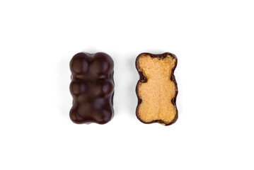 Souffle candy in chocolate in the shape of a bear on a white background.
